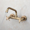 Swivel Spout Brass Wall Mounted Basin Faucet Dual Handle Mixer Tap